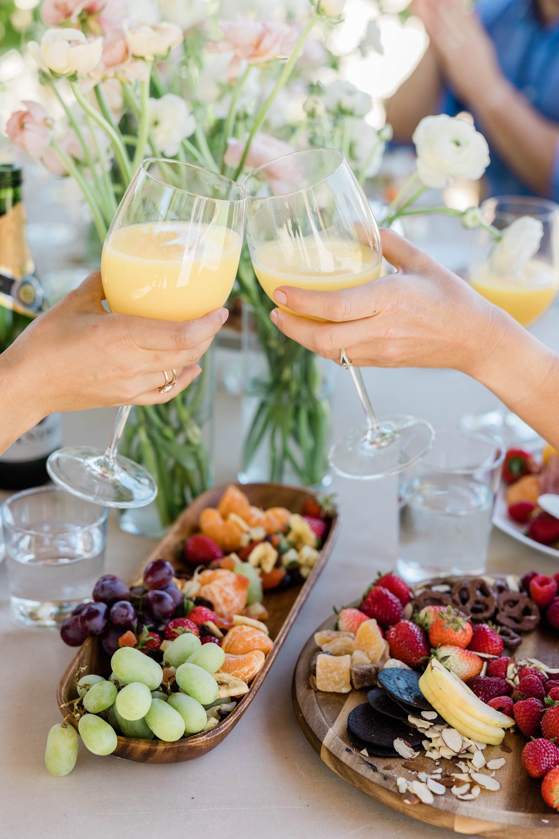 People Clinking Glasses at Brunch